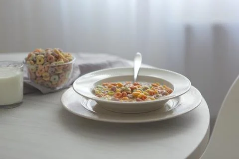 Multicolored corn rings for breakfast on the table Stock Photos