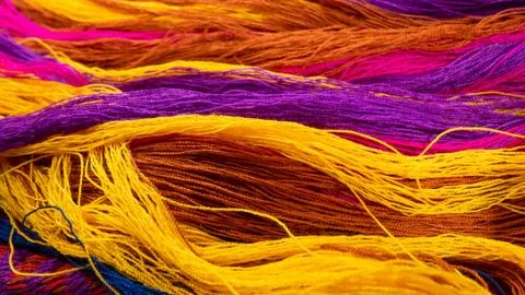 Multicolored cotton threads arranged in row Stock Photos