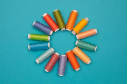 Multicolored cotton threads, spools, handmade sewing. Top view with copyspace Stock Photos
