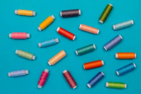 Multicolored cotton threads, spools, handmade sewing. Top view with copyspace Stock Photos