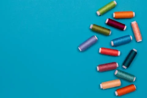 Multicolored cotton threads, spools, handmade sewing. Top view with copyspace Stock Photos