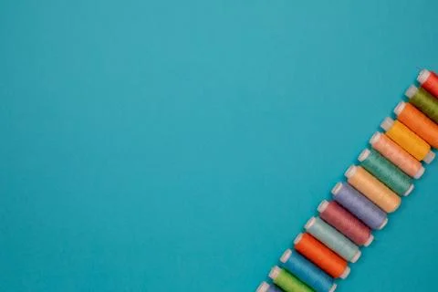 Multicolored cotton threads, spools, handmade sewing. Top view with copyspace Stock Photos