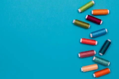 Multicolored cotton threads, spools, handmade sewing. Top view with copyspace 写真素材