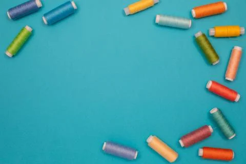 Multicolored cotton threads, spools, handmade sewing. Top view with copyspace Stock Photos