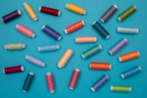 Multicolored cotton threads, spools, handmade sewing. Top view with copyspace Stock Photos