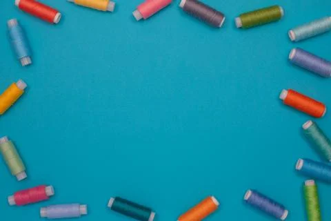 Multicolored cotton threads, spools, handmade sewing. Top view with copyspace Stock Photos