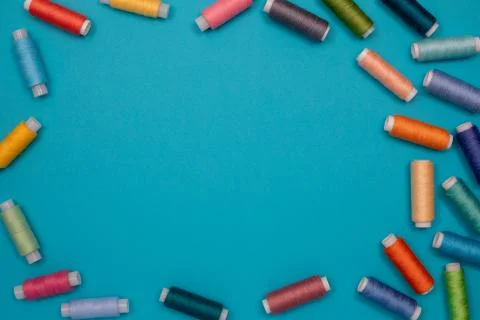 Multicolored cotton threads, spools, handmade sewing. Top view with copyspace Stock Photos