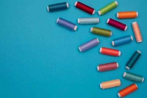 Multicolored cotton threads, spools, handmade sewing. Top view with copyspace Stock Photos