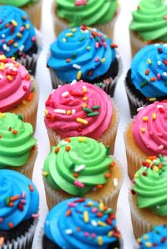Multicolored Cupcakes Stock Photos