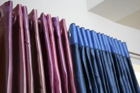 The multicolored curtains on the window. Stock Photos