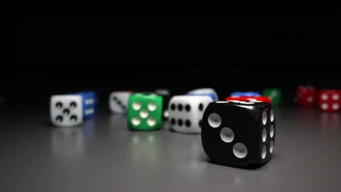 Multicolored Dice Fall on the Table Against a Black Backdrop. Rolling the Dice Stock Footage 195195497