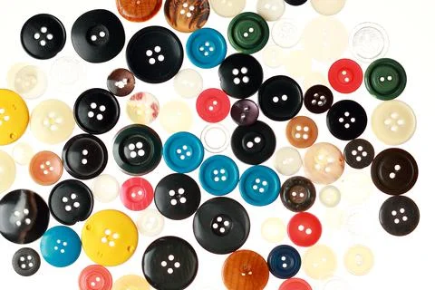 Multicolored different size buttons for clothes. Stock Photos