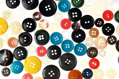 Multicolored different size buttons for clothes. Stock Photos