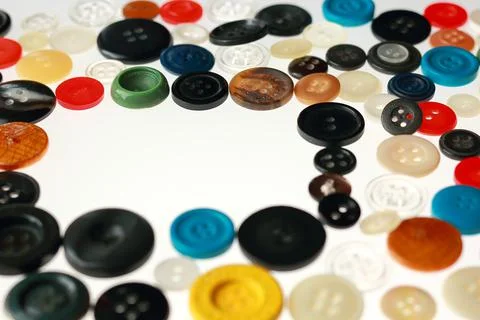 Multicolored different size buttons for clothes. Stock Photos