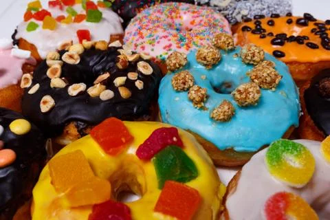 Multicolored donuts isolated on white background. Top view Foto stock