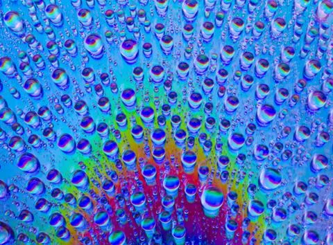 Multicolored drops of water Stock Photos