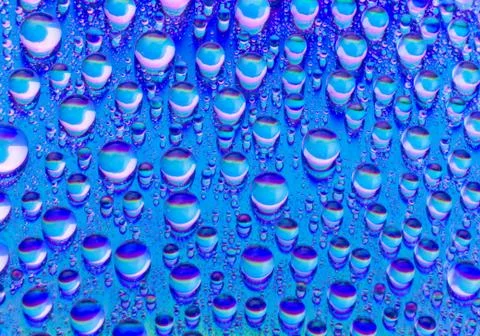 Multicolored drops of water Stock Photos