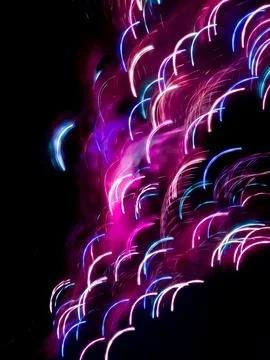 Multicolored dynamic curving light trails. Blurred lights trails making  patt Stock Photos