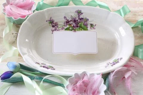 Multicolored Easter decoration with plate and flowers Stock Photos