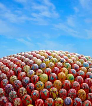 Multicolored easter eggs and blue sky. Stock Photos