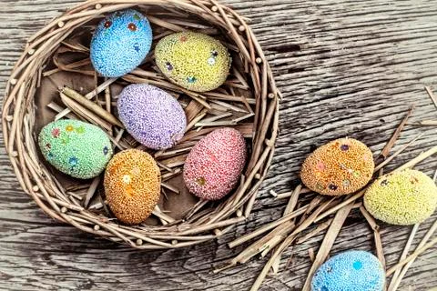 Multicolored Easter eggs in a basket 写真素材