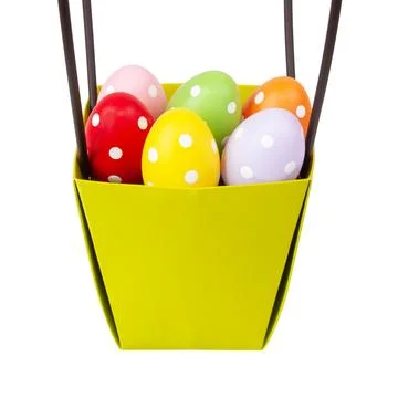 Multicolored easter eggs decorated dots in basket isolated on the white bac.. Stock Photos
