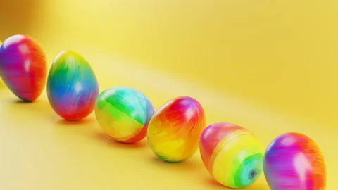 Multicolored Easter eggs roll on a yellow background. Loop animation Video stock 230958354