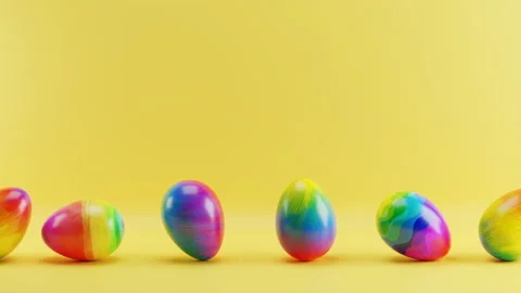 Multicolored Easter eggs rolling on a yellow background. Loop animation Video stock 230129022