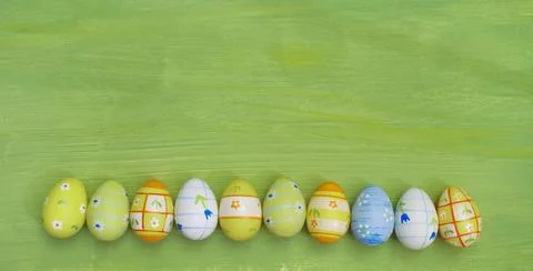 Multicolored easter eggs in  a row, design mock up template or background Stock Photos