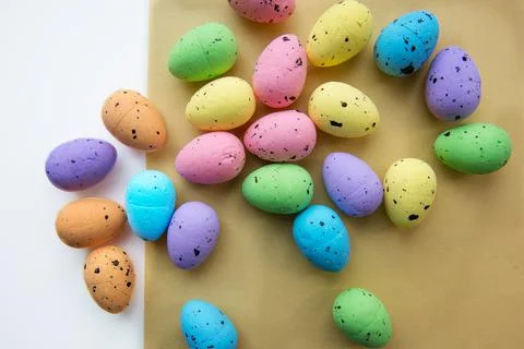 Multicolored Easter eggs on a white yellow background. Decorative easter eggs Stock Photos