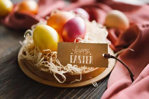 Multicolored Easter eggs on a wooden background. Stock Photos