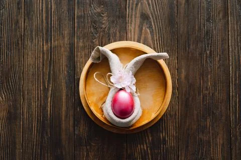 Multicolored Easter eggs on a wooden background. Stock Photos