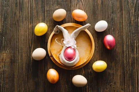 Multicolored Easter eggs on a wooden background. 库存照片