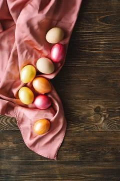 Multicolored Easter eggs on a wooden background. Stock Photos