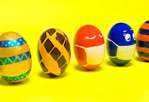 Multicolored Easter eggs on a yellow background. 스톡 사진