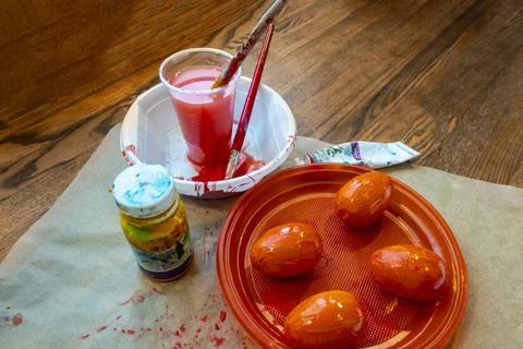 Multicolored easter painted eggs, paints and brushes. Festive Easter banner f Stock Photos