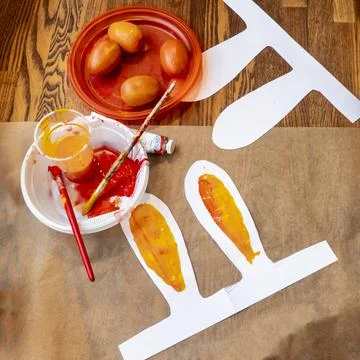 Multicolored easter painted eggs, paints and brushes. Festive Easter banner f Stock Photos