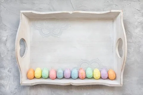 Multicolored eggs decoration on tray. Easter concept Stock Photos