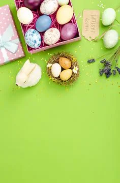 Multicolored eggs in open gift box. Concept of the Happy Easter holiday, gree Stock Photos