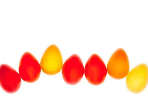 Multicolored eggs in a row Stock Photos