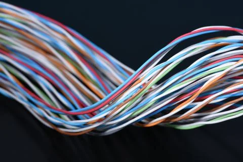 Multicolored electrical cable on dark 스톡 사진