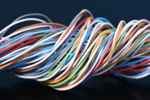 Multicolored electrical cable on dark Stock Photos
