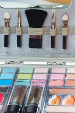 Multicolored eye shadows with cosmetics brush. eyeshadow makeup palette. colo Stock Photos