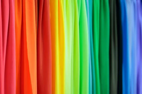 Multicolored fabrics samples in textile store Stock Photos