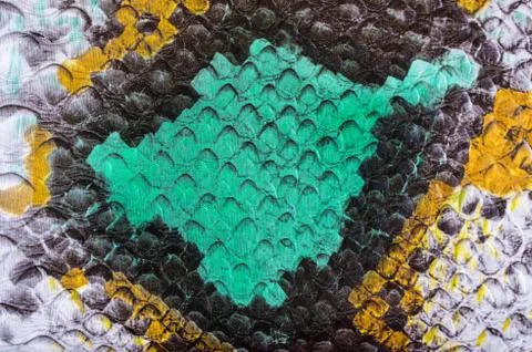 Multicolored faux leather snake Python texture for background. Close up Photos