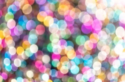 Multicolored festive bokeh as background. Stock Photos