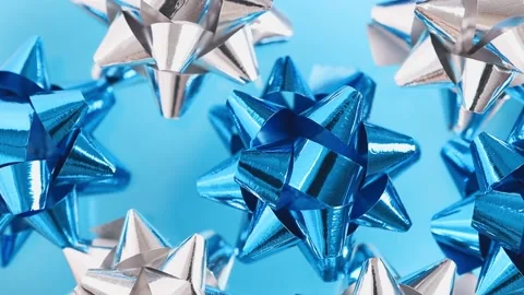 Multicolored festive decor elements are moving on a blue background. 스톡 동영상 170699539