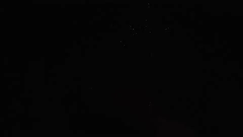 Multicolored fireworks balloons take off and explode against black night sky. Stock Footage 153612366