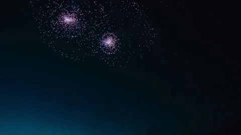 Multicolored fireworks explode against the background of the night sky with Video stock 232888254