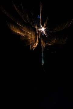 Multicolored fireworks exploding on the sky for New Year Celebration Stock Photos